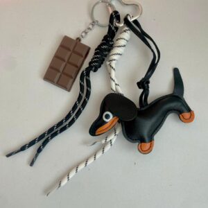 Charms salchicha negro